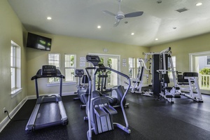 Gym with cardio and weight machines for a full-body workout.