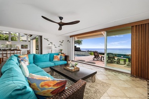 Relax into plush seating as doors open wide to the rhythm of the ocean.