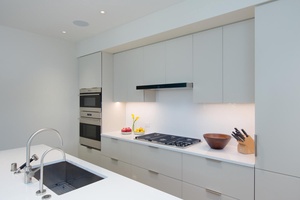 Channel your inner chef in this sleek, modern kitchen outfitted with high-end appliances and clean lines for effortless cooking and entertaining.