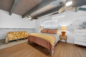 Expansive sleeping area with a long daybed, ideal for extra guests or a comfortable lounging space.