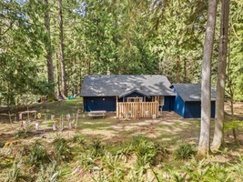 Tucked into the woods, the home blends naturally into its surroundings for ultimate relaxation.