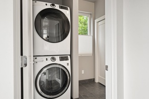 Full-size washer and dryer tucked near the entry for your mid-stay refresh.