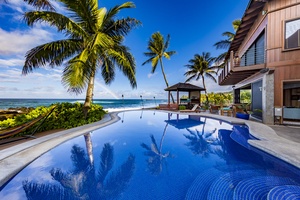 Take a refreshing dip in the oceanfront pool surrounded by tropical serenity.