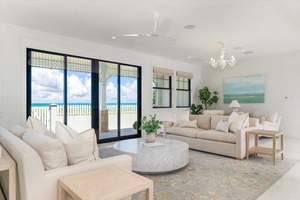 Spacious living area with natural light, elegant finishes, and direct access to the pool terrace.