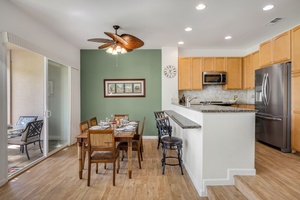 Fully equipped kitchen with granite countertops and modern stainless steel appliances for effortless meal prep.