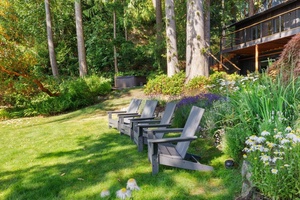 Enjoy the hot tub tucked away in the trees.