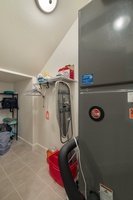 Your dedicated laundry space keeps your travel wardrobe fresh with modern appliances and convenient storage.