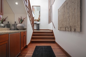 Indoor wet bar located at the bottom of the staircase.