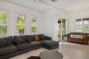 Living area with a comfy sectional sofa and access to the patio.