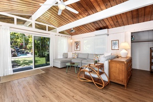 Sink into your stylish sectional sofa while tropical breezes flow through floor-to-ceiling windows overlooking lush gardens.