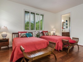 Second-floor guest bedroom with two full size beds