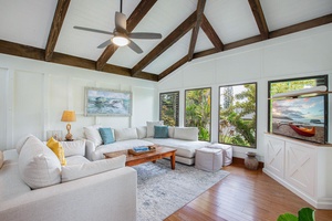 Comfort meets island elegance in this breezy living space with new furnishings and natural light.