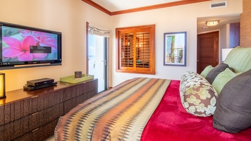 The spacious primary bedroom with a king bed.