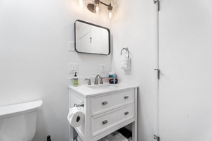 Guest bathroom with modern vanity and thoughtful touches for a stress-free stay.