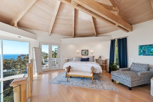 Primary bedroom with a king bed and amazing views and open loft concept