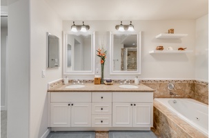 Primary Bedroom ensuite bathroom with dual-sink vanity and large jetted bathtub