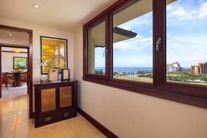 Wake up to breathtaking ocean views through your elegant mahogany-framed windows, where tropical paradise meets luxurious comfort in your beautifully appointed suite.