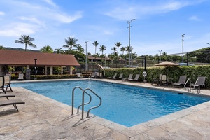 Lounge poolside with views of the community’s lush landscaping and resort-style ambiance.