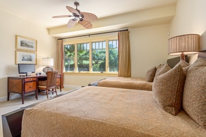 Wake up to lush green views in this comfortable guest room with queen beds.