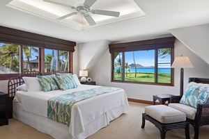 Upstairs primary bedroom with a king-size bed and stunning ocean views.