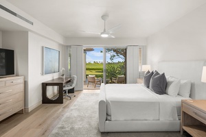 Wake up to tropical paradise in your serene bedroom, where clean lines and soft linens create the perfect retreat.