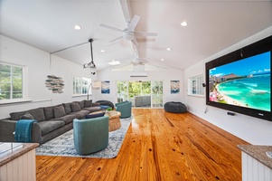 Media room with a large deck that has a birds eye view of the pool!