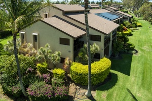 Sculpted tropical hedges provide added privacy and beauty around your ground-level lanai—lush, green, and serene.