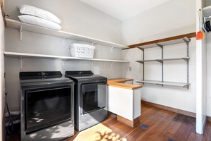 Expansive laundry room with dual washer / dryers