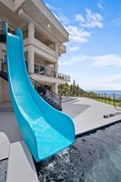 Make a splash down the thrilling waterslide into the infinity pool.