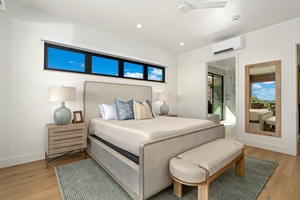 Drift off in your serene bedroom with stunning blue sky views through sleek windows, soft linens, and modern comfort.
