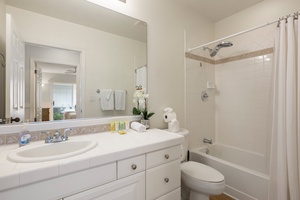 Second bathroom with elegant quartz vanity and tub/shower combo for added comfort and flexibility.