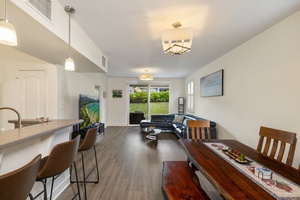 Step into your spacious open-plan retreat where natural light streams through sliding doors to the garden.