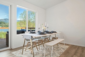 Wake up slowly or savor your morning tea in this sunny dining nook designed for relaxed lakeside living.