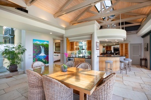 Vaulted ceilings and a natural wood dining table set the stage for memorable meals and good conversation.