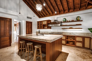 The expansive kitchen is a chef's delight featuring the kitchen bar with seating for three.
