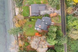 Bird’s-eye view of your serene escape—plenty of green space, privacy, and natural beauty just steps from the water.