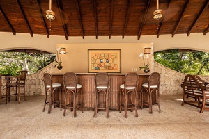 The gazebo offering ample seating for outdoor gatherings.