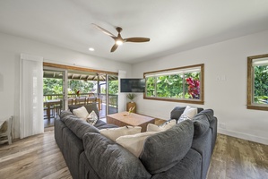 Cozy lounge area ideal for reading, relaxing, or morning coffee surrounded by lush outdoor views.