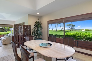 Dining area with a table that comfortably seats 6, featuring scenic views of the outdoors.