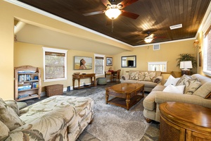 Large smart TV and entertainment setup create a perfect family hangout spot.