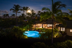 Enjoy a peaceful evening by the illuminated pool.