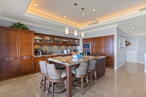 Gather around the kitchen island at Wailea Luxury Residence Hoolei 23-3 for wine or casual bites.