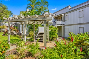 Lush landscaped path welcomes you to Wailea Ekolu 1605, your serene Maui escape.