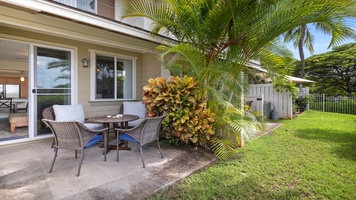 Relax outdoors surrounded by lush greenery—the perfect spot for a quiet morning coffee or evening drink under the palms.