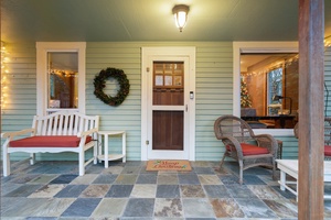 Step into the holiday spirit with a wreath-trimmed door and inviting entryway.