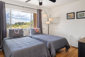 With beautiful views and a ceiling fan, this twin room offers quiet comfort in a bright, breezy setting—perfect for families or guests.