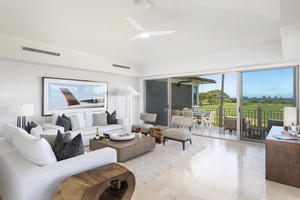 Relax in your elegant living space with sweeping golf course views from floor-to-ceiling windows that open to your private balcony.