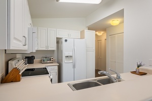 Your fully equipped kitchen awaits with modern appliances and ample counter space for preparing delicious meals during your stay.