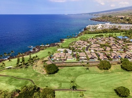 Take your shot at the Kona Country Club golf course nearby.