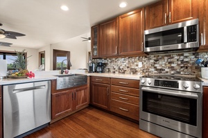 Modern kitchen with stainless steel appliances and ample counter space.